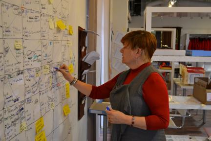 Laurie Blakeman writes on the schedule dominating the wall of her campaign office in Edmonton