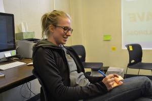 Wildrose candidate Meagen LaFave sits in her office writing on post-it notes