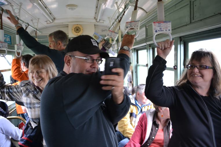 One of the Shareable Neighbourhood walkers takes a picture of me taking a picture of him on the streetcar
